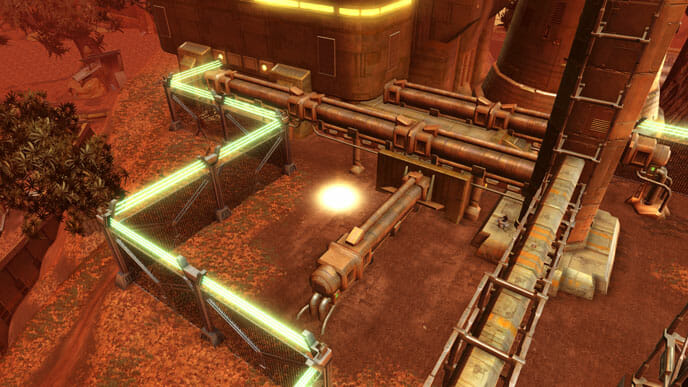 Das orangefarbene Datacron liegt innerhalb der Umzäunung neben den Rohren.